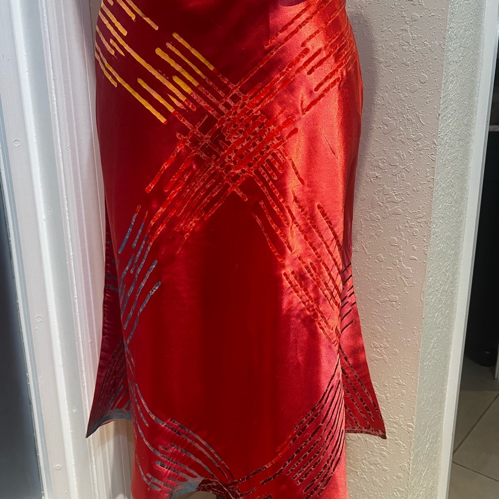 TROSMAN ASYMMETRICAL CORAL MIDi SLIP SKIRT.